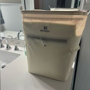 New, never used Stanley backpack cooler. Cream, no tags.